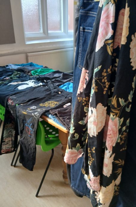 Close up image of some clothes on display as part of a sale